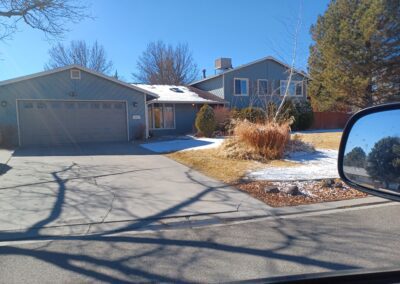 Residential house with attached garage and driveway.